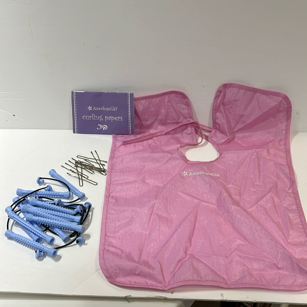 American Girl hair curling accessories includes: apron, Bobby pins, curlers